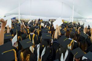 Students cheering at Commencement.