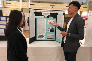 Two students discuss a presentation