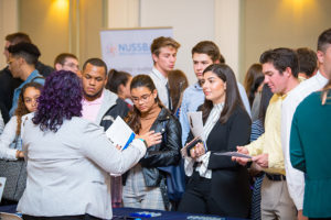 Students network at the Alumni Networking event in Smith Hall.