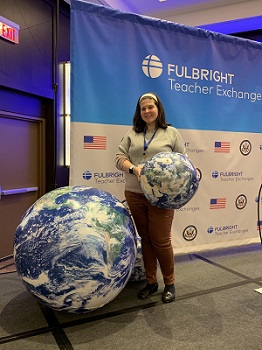 Christina Mesk '04 Poses with a globe
