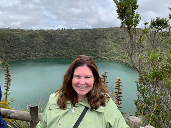 Christina Mesk '04 poses in front of a lake in Colombia