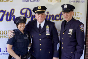 Blair poses with police officers.