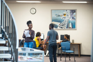 Two students talk in the Elizabeth Seton Library.