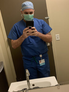 Nicholas Malizia in scrubs