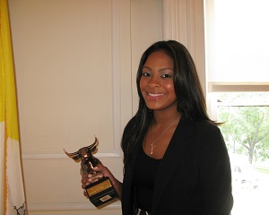Annalisa Teekah Vazquez posing with a trophy