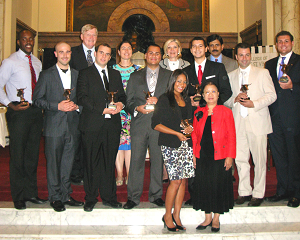A group of graduates from the first cohort of the MBA program pose for a photo