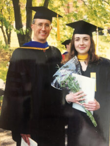 Ellen Carlin poses in her cap and gown with Dr. Judge