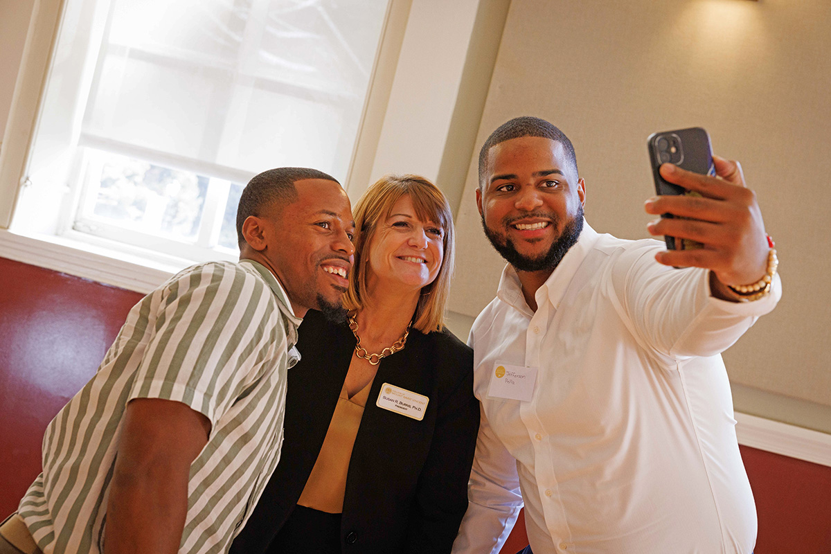 President Susan R. Burns, Ph.D. takes a selfie with two alums from the College of Mount Saint Vincent