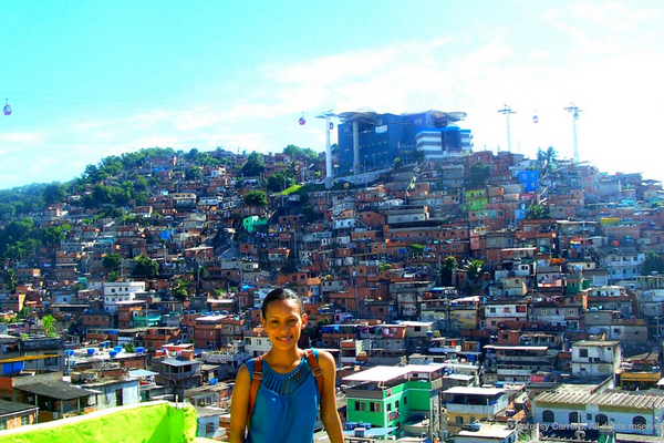 Yafreisy Carrero '10 poses in front of a town in Rio.