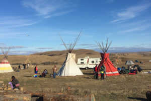 Overview of Standing Rock teepees on a sunny day. 