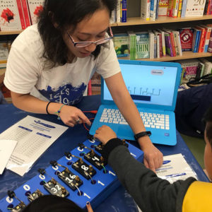 Student and teacher work on a science project. 