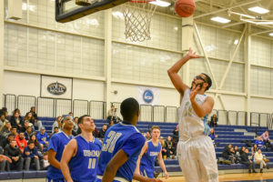 Andrew Curiel shooting hoops.