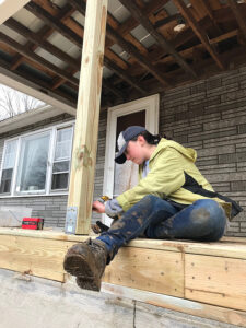 Student working on building a house. 