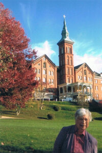 Sr Paula and Founders Hall in the background
