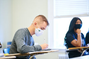 Student wearing a mask in the classroom.