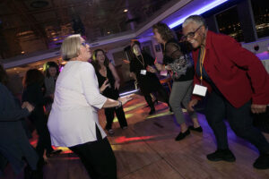 Alumni dancing on a cruise ship.