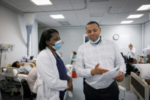 Jordan Yakoby with a nurse. 