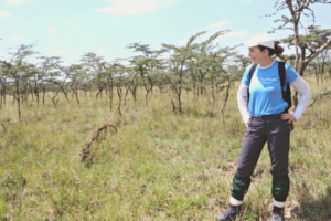 Ellen Carlin poses in a field in Kenya