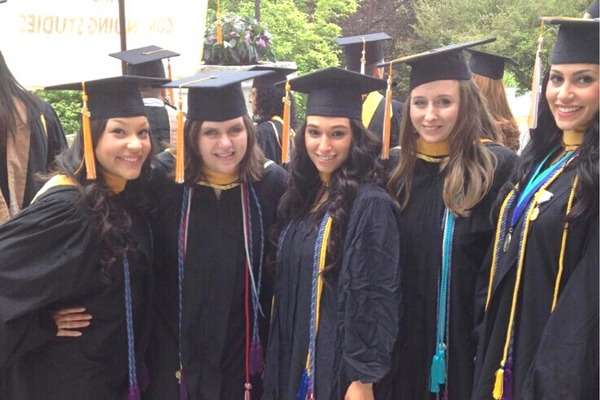 Maire Fox '12 and her classmates pose at their master's graduation from the Mount