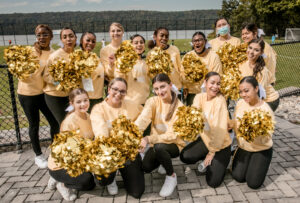CMSV cheerleaders pose with their pom poms